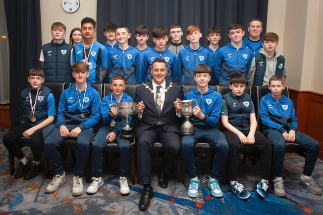 The Mayor, Graham Warke presenting Oxford United Stars FC U14s with the League Cup at Thursday night's awards. At back are coaches Jodie Walker and John Walker. Picture by Jim McCafferty