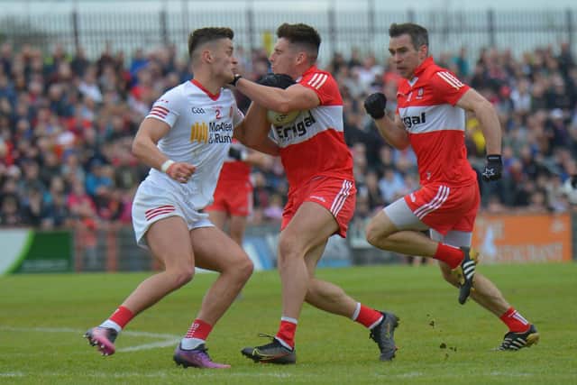 Tyrone's Michael McKernan struggles to contain the run of Derry's Donor Doherty during the Oak Leafers superb Ulster Championship win in Healy Park. (Photo: George Sweeney)