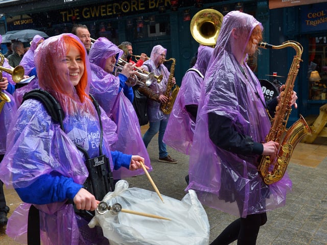 Local musicians take part in the DLD Second Line Parade at the Jazz Festival on Saturday afternoon. Photo: George Sweeney. DER2217GS – 120
