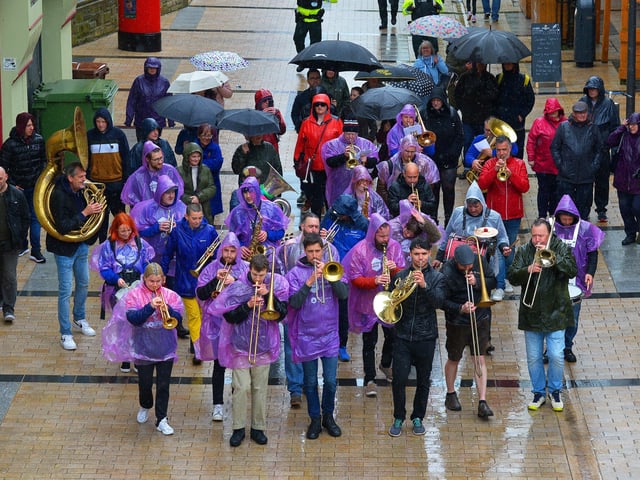 The DLD Second Line Jazz Parade makes its way along Custom House Street on Saturday afternoon. Photo: George Sweeney. DER2217GS – 121