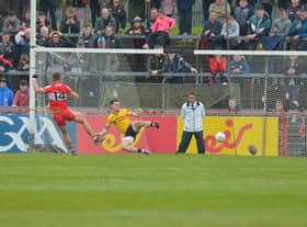 Derry's Shane McGuigan scores a first half penalty against Tyrone at Healy Park on Sunday afternoon. (Photo: George Sweeney)