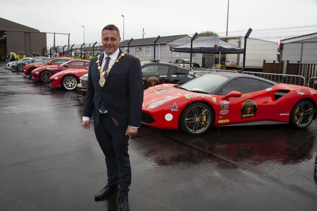 The Mayor, Graham Warke pictured beside some of the super cars at Saturdayâ€TMs Bear Run 74 event in City of Derry Airport.