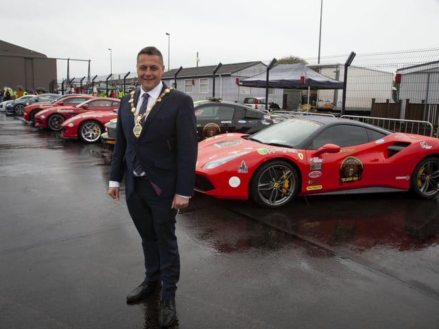The Mayor, Graham Warke pictured beside some of the super cars at Saturdayâ€TMs Bear Run 74 event in City of Derry Airport.