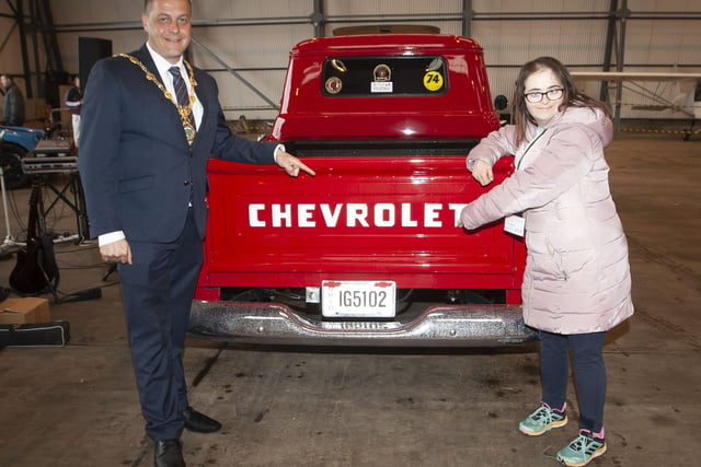 CHECK THIS OUT. . . . .The Mayor Graham Warke and Jill McCallion check out this Chevrolet during Saturdayâ€TMs event.