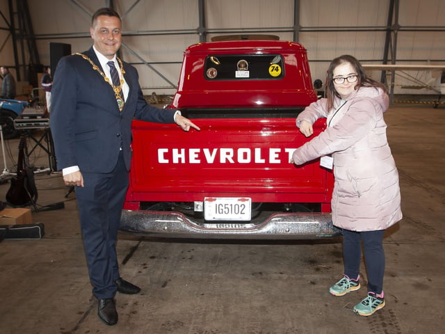 CHECK THIS OUT. . . . .The Mayor Graham Warke and Jill McCallion check out this Chevrolet during Saturdayâ€TMs event.
