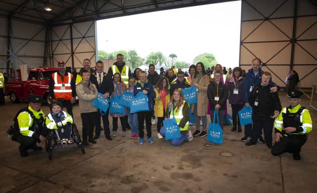 BEAR RUN 74. . . . .The Mayor, Graham Warke, organisers and parents, children and staff from Foyle Down Syndrome Trust pictured receiving goodie bags from Marissa McGilligan, City of Derry Airport during Saturday's Bear Run 74 VIP event at the airport. (Photos: Jim McCafferty Photography)