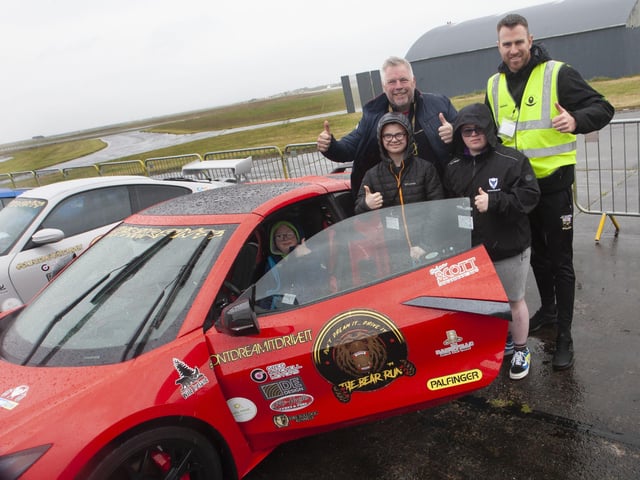 Three happy young men from Foyle Down Syndrome Trust pictured at Des Adam's C8 Corvette on Saturday - Kyle McFaul, Jack Rogers and Corey Norris. Included is Christopher Cooper, FDST.