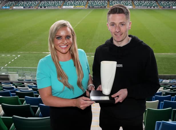 Ruth Gorman, chairwoman of the Northern Ireland Football Writers’ Association (NIFWA) presents Ryan Curran with the Danske Bank Player of the Month for April.