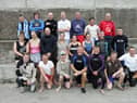 Participants in the annual charity swim from Saddle Rock to Portmore Pier in aid of the Donegal Hospice and Foyle Hospice. Front, from left, are Conal Morrison, Martin O'Connor, Fr. Peter Deeney, Aidan McKinney, Mark Mullarkey, Colm Kelly and Frank Dunlop. Centre, from left, are Colette Doherty, Ann Marie Coffey, Daniel Conaghan, Sandra McKeeney, Catherine Kelly, Julie Doherty, Hugh McDonald and Ronan Doherty. Back, from left, are Anthony Coffey, Emmet Gibson, Emmet Farren, Aidan Doherty, Paul Doherty, Gerard Stevens and Kevin Farren. (1808C01)