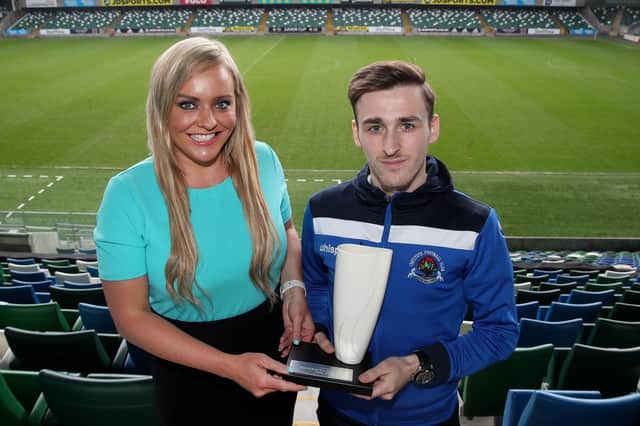 Ruth Gorman, chairwoman of the Northern Ireland Football Writers’ Association (NIFWA) presents Institute's Jamie Dunne with April's Championship Player of the Month prize.