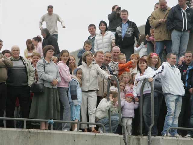 Crowds watch the charity swim from Portmore Pier. (1808C07)