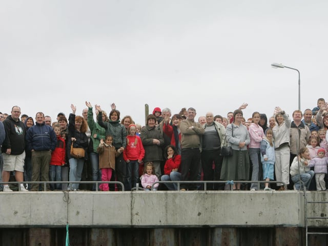 Crowds watch the charity swim from Portmore Pier. (1808C08)