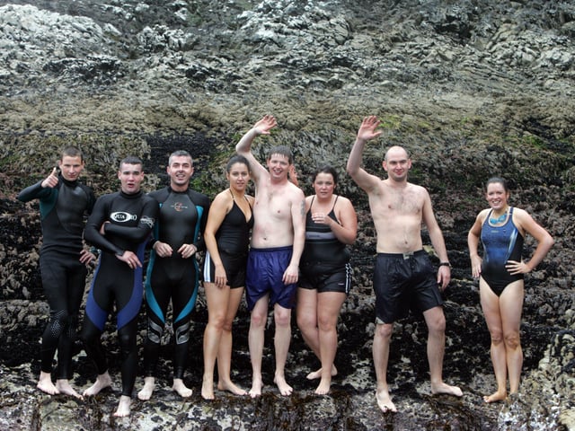 Swimmers on Saddle Rock before setting off on the charity swim to shore. (1808C03)