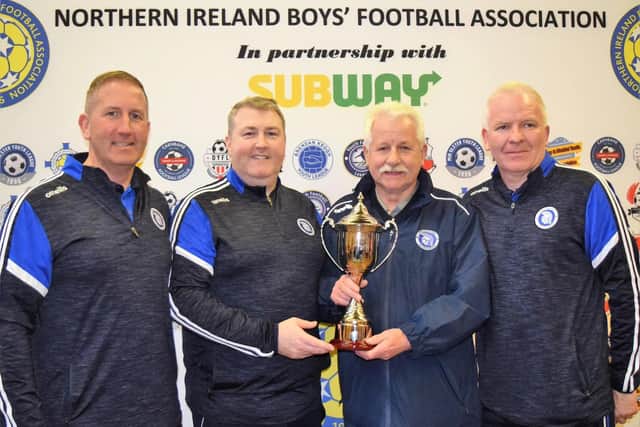 Trojans coaches, Niall Creagh, George Dunlop, club chairman, Paddy McLarn and Jim McGuinness with the Subway NIBFA Cup.