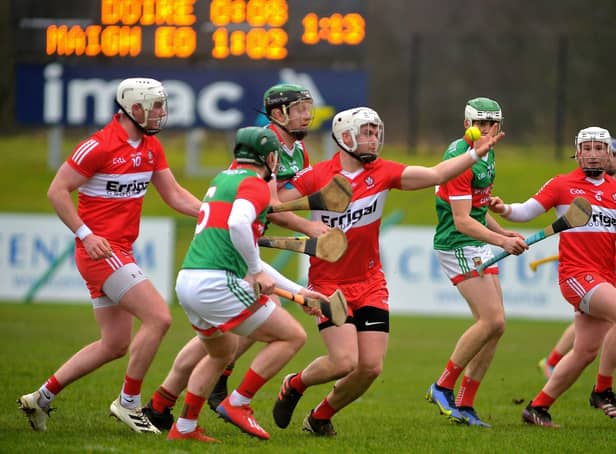 Eamon McGill comes under pressure from Mayo players during Derry's National League victory at Owenbeg. The two sides meet this weekend with the winner assured of a spot in the Christy Ring Cup Final. (Photo: George Sweeney)