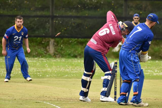 Donemana's William McBrine bowls Eglinton's Andy Millar, during Saturday's game at the Holm. Picture by Lawrence Moore