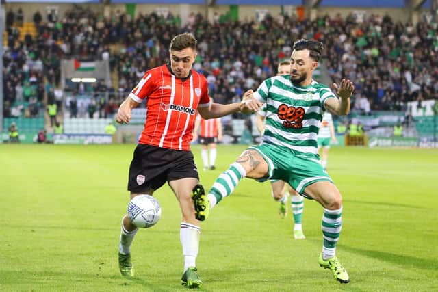 Derry City midfielder Joe Thomson holds off Shamrock Rovers' Richie Towell. Picture by Kevin Moore/MCI