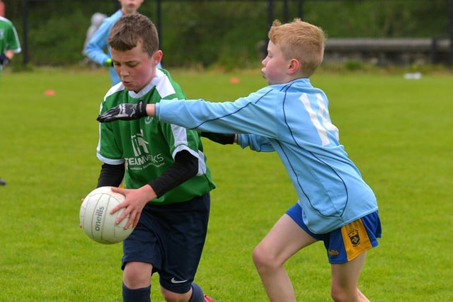 Bunscoil Cholmcille in action against Hollybush ‘B’ in the Steelstown Schools Cup, at Páirc Brid.