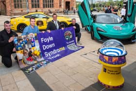 Mayor Graham Warke launches 'Supercar Saturday' with, from left, Christopher Cooper, Manager of Foyle Down Syndrome Trust, Keith  Gamble and Gary McCaul. Picture Martin McKeown. 13.05.22