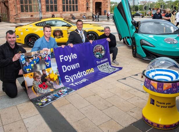 Mayor Graham Warke launches 'Supercar Saturday' with, from left, Christopher Cooper, Manager of Foyle Down Syndrome Trust, Keith  Gamble and Gary McCaul. Picture Martin McKeown. 13.05.22