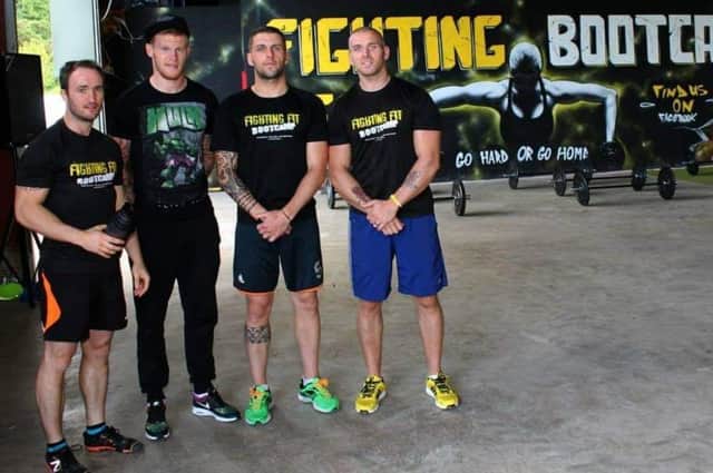 Ireland international James McClean pictured with Fighting Fit coaches during one of his many visits to the gym.
