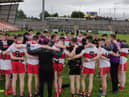 Manager Martin Boyle chats to his Derry minors players after defeating Cavan on Saturday in the Armagh Atheltic Grounds.