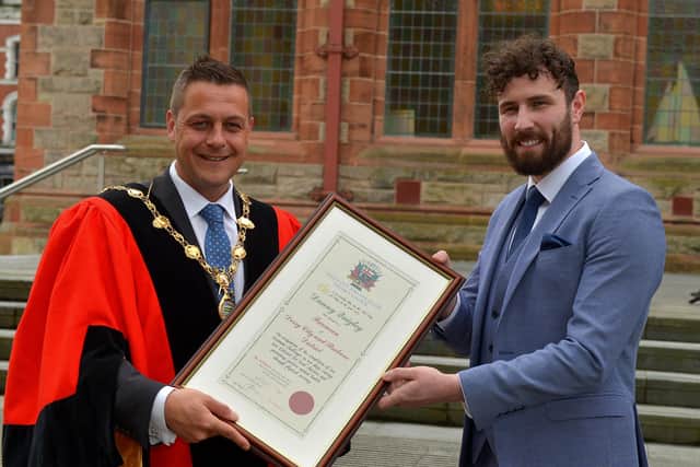 Endurance athlete and Health and Wellbeing Campion Danny Quigley pictured with Mayor Graham Warke after he was conferred with the Freedom of the City and Strabane, at a special ceremony in the Guildhall, on Monday afternoon.  Photo: George Sweeney.  DER222GS – 004
