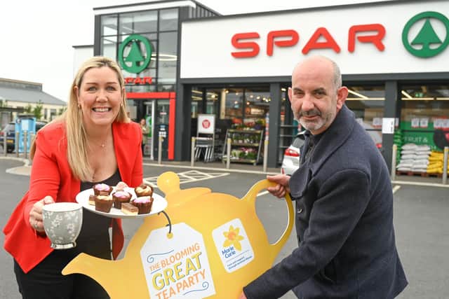 ronagh Luke from Henderson Group and Conor O'Kane from Marie Curie, marking the return of the Blooming Great Tea Party this May