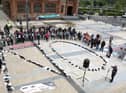 Protesters in Derry spelled out the word "no" using the shoes of victims.