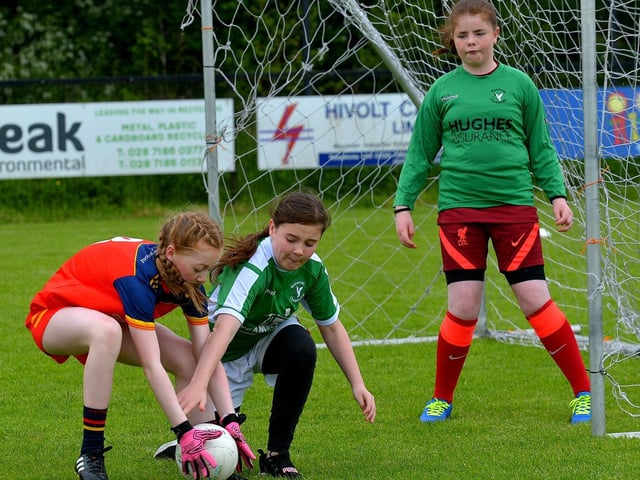 Steelstown take on Bunscoil Cholmcille in the recent Steelstown Primary Schools Girls Cup, at Páirc Brid. DER2220GS-052 Picture by George Sweeney.
