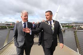 Congressman Richard Neal walks across Derry's Peace Bridge with Mayor Graham Warke on Wednesday. Photo: Lorcan Doherty