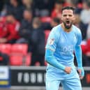 Mansfield Town's Stephen McLaughlin rallies the team during the Sky Bet League 2 match against Salford City FC at The Peninsula Stadium.  Picture by Chris Holloway / The Bigger Picture.media