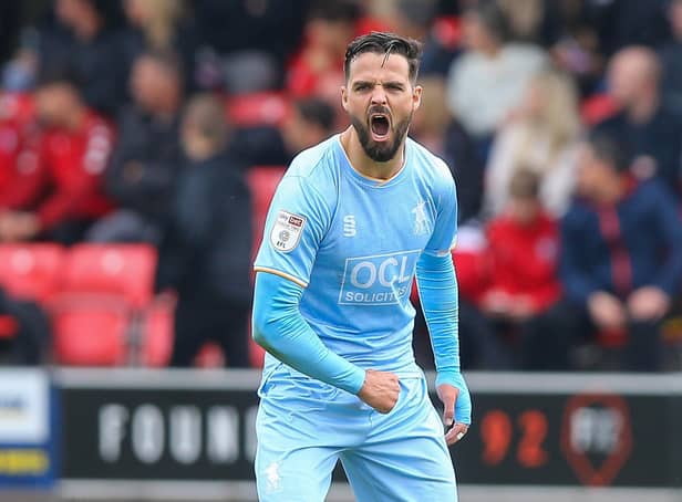 Mansfield Town's Stephen McLaughlin rallies the team during the Sky Bet League 2 match against Salford City FC at The Peninsula Stadium.  Picture by Chris Holloway / The Bigger Picture.media