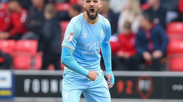 Mansfield Town's Stephen McLaughlin rallies the team during the Sky Bet League 2 match against Salford City FC at The Peninsula Stadium.  Picture by Chris Holloway / The Bigger Picture.media