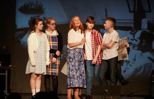 Actors on stage in 'A Green Hill Far Away'.