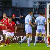 Seamas Keogh races away to celebrate his last gasp winner against Derry City on Monday night at the Sligo Showgrounds. Photograph by Kevin Moore.