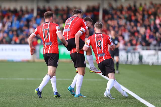 Derry City players celebrate with goalscorer Will Patching in the first half. Photographs by Kevin Moore.