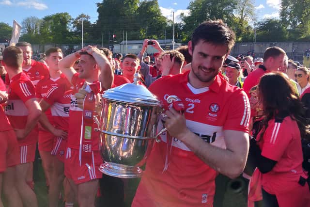 Derry captain Chrissy McKaigue gets his hands on the Anglo Celt Cup after their victory in Clones on Sunday.