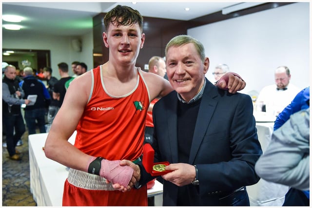 Eoghan Quinn ,St John's receives his prize from former European lightweight champion Charlie Nash.