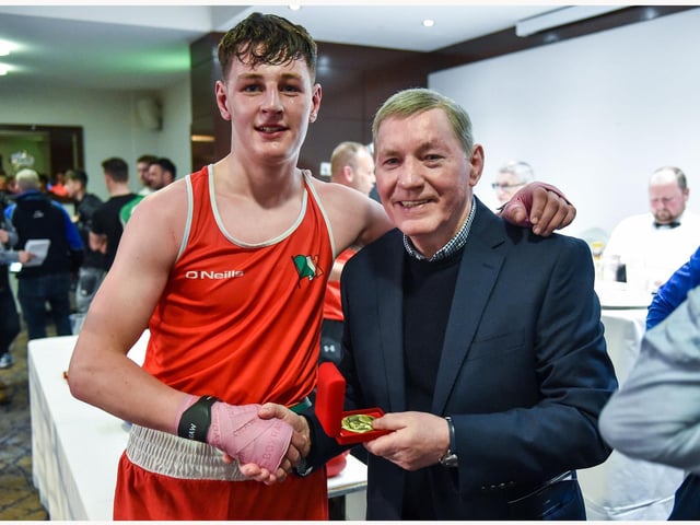 Eoghan Quinn ,St John's receives his prize from former European lightweight champion Charlie Nash.