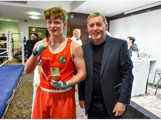 Ruairi Holmes ,Oakleaf is presented with his prize by former European lightweight champion and world title contender Charlie Nash after his win over Ben Berniet (Waterside).