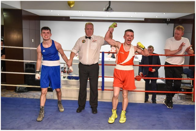 Tiarnan Glenon St Joseph's takes the decision over Rys Owens ,Erne B C in this U18 57kg bout.