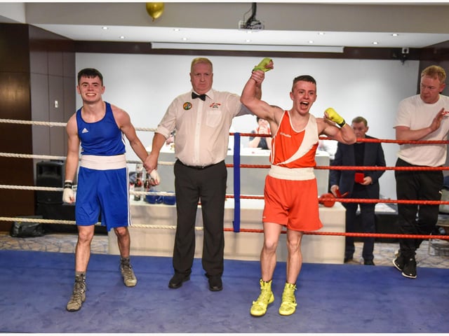 Tiarnan Glenon St Joseph's takes the decision over Rys Owens ,Erne B C in this U18 57kg bout.