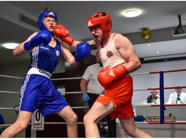 Neill McAllister ,ST Johns and Robbie Wilson ,Coleraine exchange blows at the Maldron Hotel.