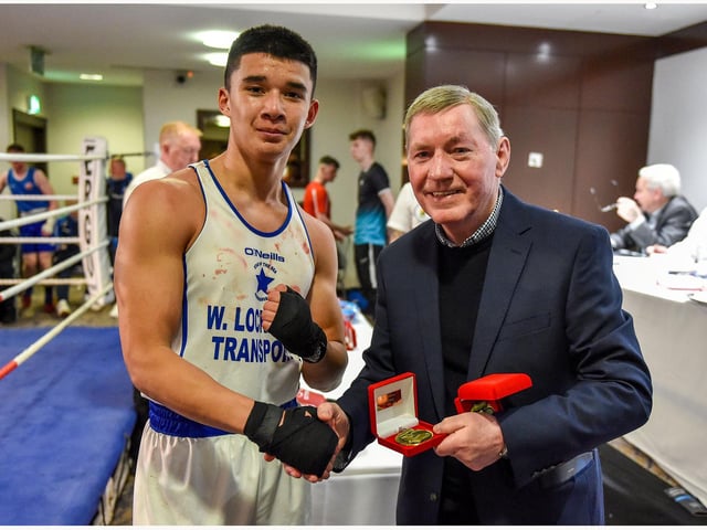 Danny Tuzi,Star Of The Sea  is presented with his award by Co. Derry Boxing Board guest of honour, former European lightweight champion, Charlie Nash.