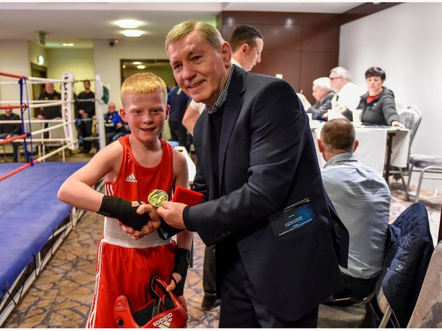Josh Cairns ,Oakleaf is presented with his prize from former EBU European lightweight champion Charlie Nash at the Maldron Hotel.