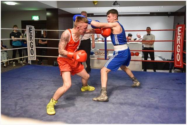 Tiarnan Glenon St Joseph's and Rys Owens,Erne B C produced one of the bouts of the night in this no headguards contest.