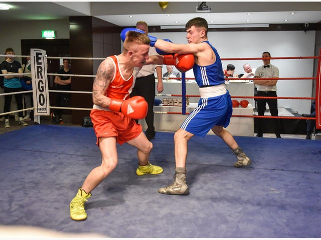 Tiarnan Glenon St Joseph's and Rys Owens,Erne B C produced one of the bouts of the night in this no headguards contest.