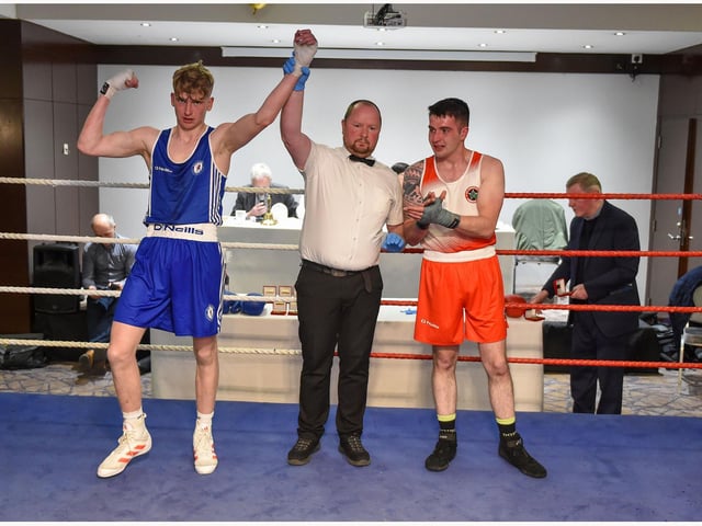 Robbie Wilson ,Coleraine takes the decision over  Neill Mc Allister ,ST Johns