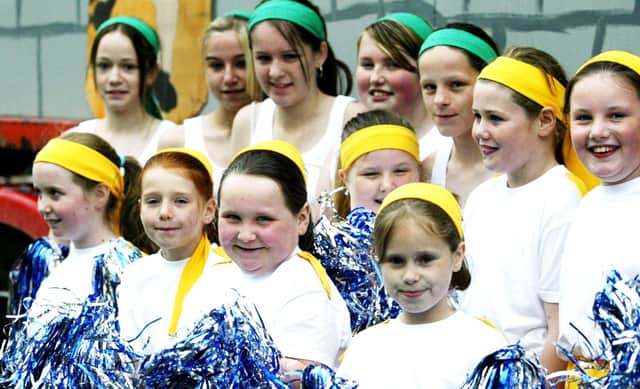 Young cheerleaders from Cornshell Fields await the start of the parade.